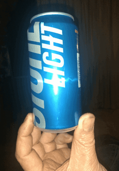 Hand Holding Blue Light Can GIF