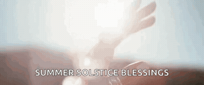 Hand Holding Candle Summer Solstice Blessings GIF