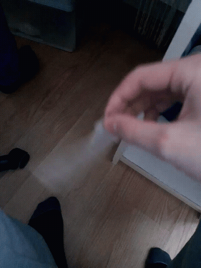 Hand Holding Clear Plastic GIF