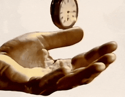 Hand Holding Clock Showing 1 And 5 GIF
