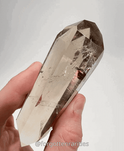 Hand Holding Crystal Saying Forgotten Rarities GIF