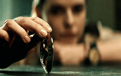 Hand Holding Liberty Coin GIF