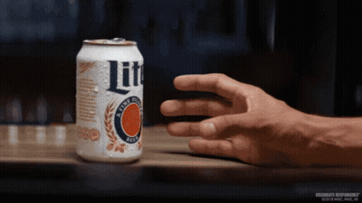 Hand Holding Lite Beer Can