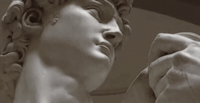 Hand Holding Man Statue Eyes Closed GIF