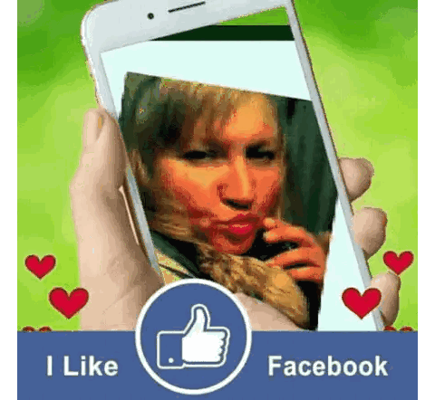 Hand Holding Phone With I Like Facebook Sticker