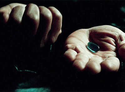 Hand Holding Red And Blue Pills GIF