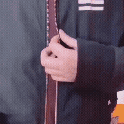 Hand Holding Zipper On Jacket GIF