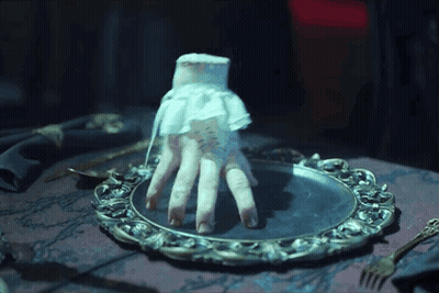 Hand In White Lace Glove On Silver Plate GIF