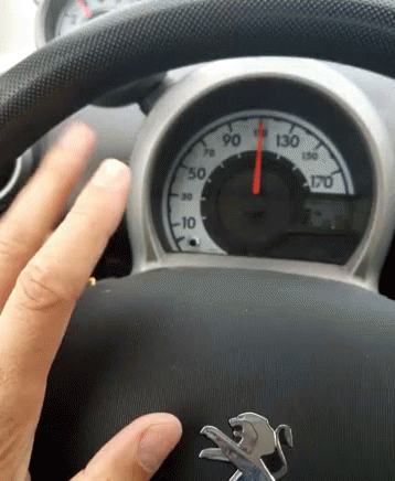Hand On Steering Wheel With Speedometer At 90 GIF