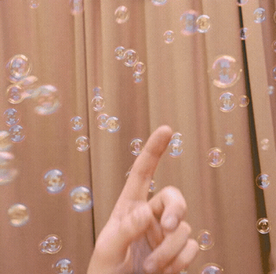Hand Pointing At Soap Bubbles GIF