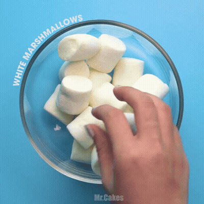 Hand Reaching For Marshmallows In Bowl GIF