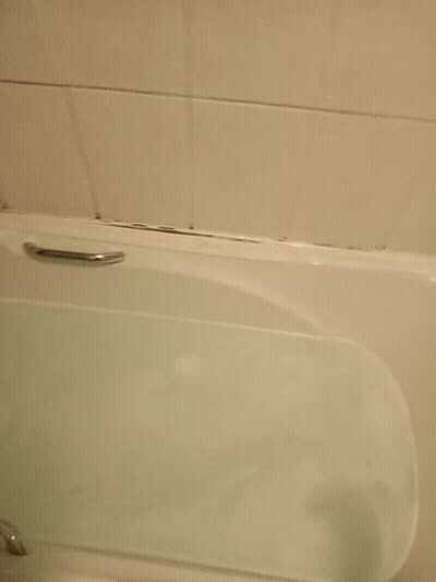 Hand Reaching Into Bathtub GIF