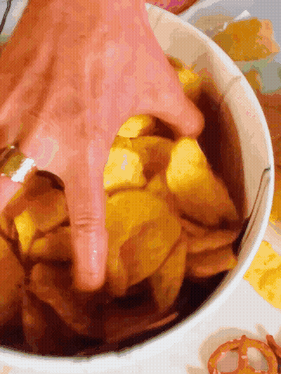 Hand Reaching Into Bowl Of Potato Chips GIF