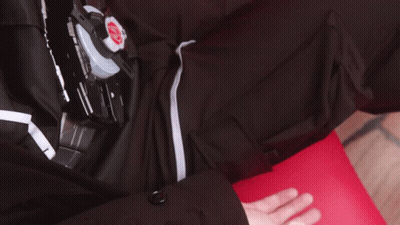 Hand Reaching Toward Black Shirt With Red K GIF