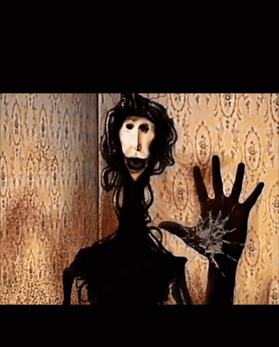 Hand Reaching Toward Ghostly Figure GIF