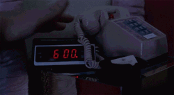 Hand Stopping Alarm Clock GIF