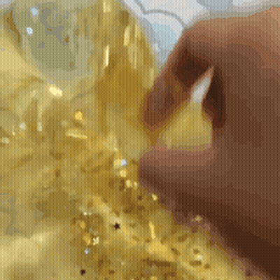 Hand Touching Gold Fabric GIF