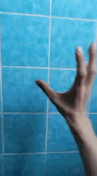 Hand Twitching In Bathroom GIF