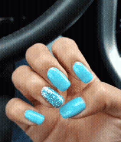 Hand With Blue Nails And Silver Glitter GIF