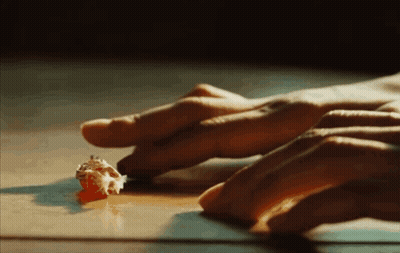 Hands Reaching For Small Object GIF