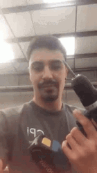 Handsome Guy Showing His Handheld Drill GIF
