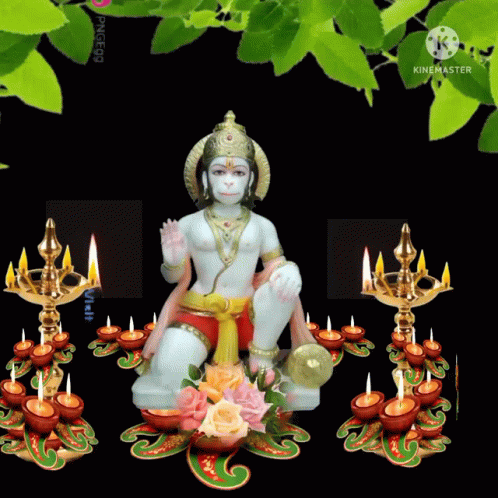 Hanuman Statue Surrounded By Lit Candles GIF