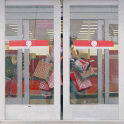 Happy Black Friday Woman Leaving Store With Bags GIF