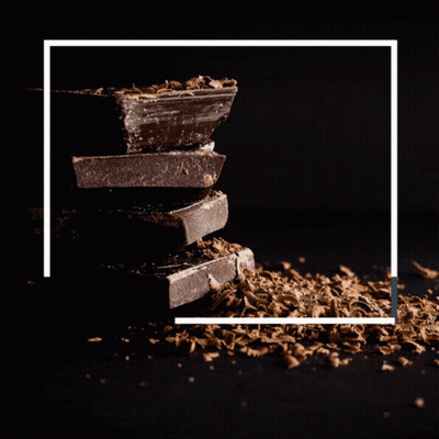 Happy Chocolate Day Couple with Pile of Chocolate
