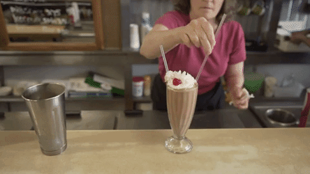 Happy Couple Sip Milkshake  GIF