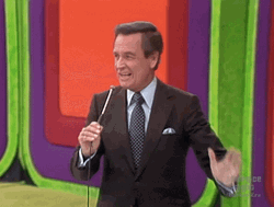 Happy Gilmore Bob Barker Holding Mic With Hand Gesture GIF