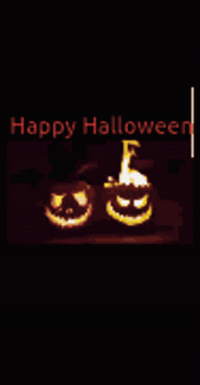 Happy Halloween Greeting Card With Two Carved Pumpkins On Fire GIF