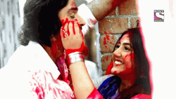 Happy Holi Couple Painting Face GIF