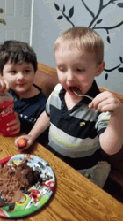 Happy Kid Eating Cake GIF