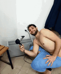 Happy Man Using Dry Heat Blower GIF