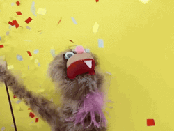 Happy Puppet Showering Confetti GIF
