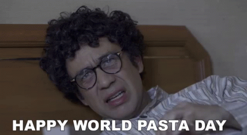 Happy World Pasta Day Curly Haired Glasses Man On Bed GIF