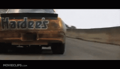 Hardees Car Driving Down A Road GIF