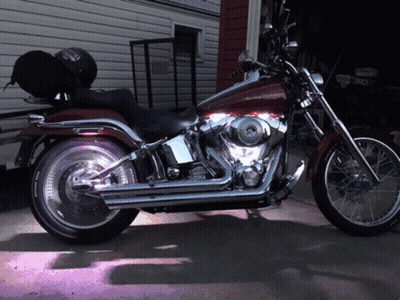 Harley Davidson Motorcycle Parked In Front Of Garage GIF