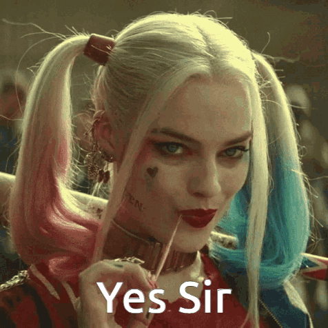 Harley Quinn From Suicide Squad Is Holding A Lollipop In Her Mouth And Says Yes Sir GIF