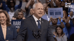 Harris Walz Salutes Audience GIF