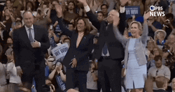 Harris Walz With Team Waiving Hands GIF