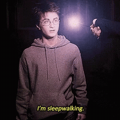 Harry Potter Is Holding A Wand And Says I 'M Sleepwalking . GIF