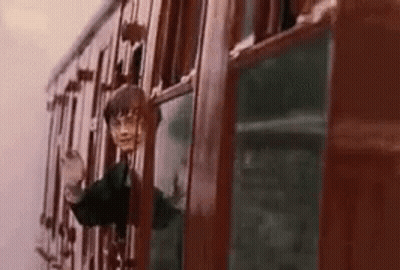 Harry Potter Is Looking Out Of A Train Window While Riding A Train . GIF