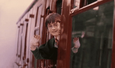 Harry Potter Is Riding A Train And Waving Out Of The Window . GIF