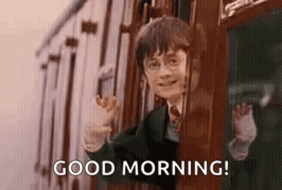 harry potter is waving out of a train window and saying good morning .