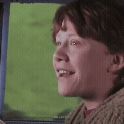 Harry Potter Is Wearing Glasses And Looking Out The Window GIF