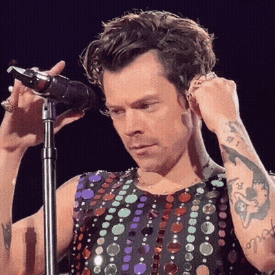 Harry Styles Holding Towel And Talking GIF