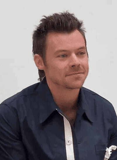 Harry Styles In Blue Shirt With White Stripe Sleeves GIF