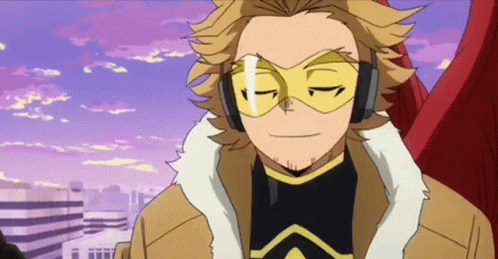 Hawks From My Hero Academia Is Wearing A Mask And Headphones While Standing In Front Of A City . GIF