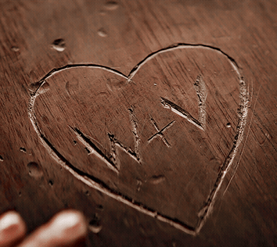 Heart Carved In Wood With Letters W And X GIF